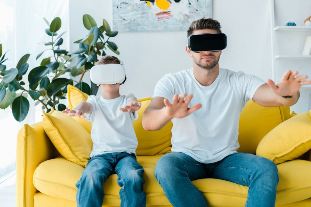 father and son in virtual reality headsets gesturing in living room