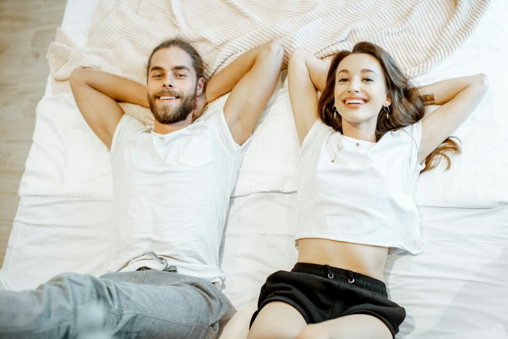 Portrait of a young couple on the bed